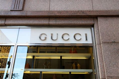 who owns Gucci fashion house